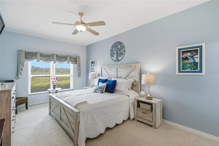 The primary bedroom has a double window that provides easy viewing of the space behind.