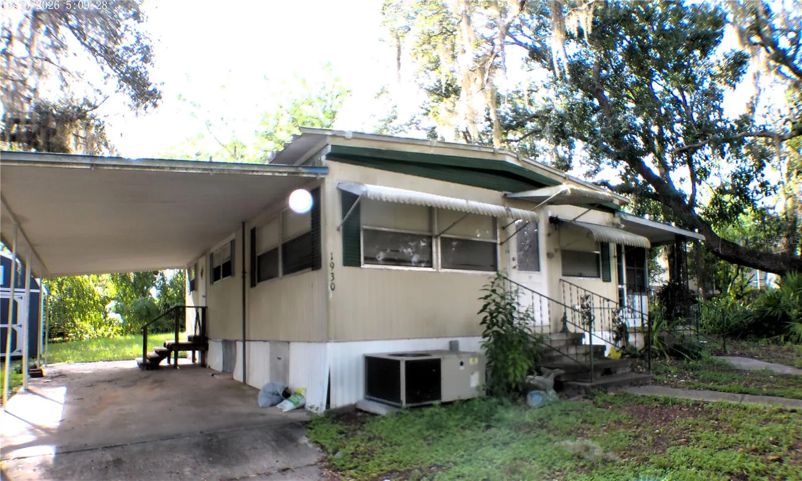 CARPORT LEFT OF FRONT