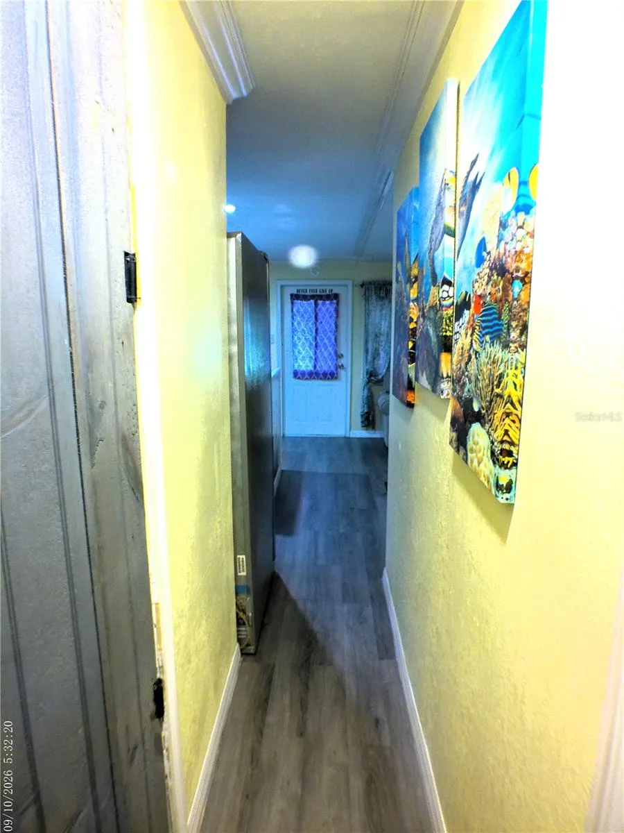 HALLWAY VIEW FROM BEDROOMS. BATHROOM ON LEFT