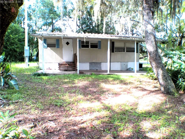 CARPORT LEFT SIDE OF HOME