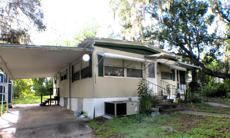 CARPORT LEFT OF FRONT