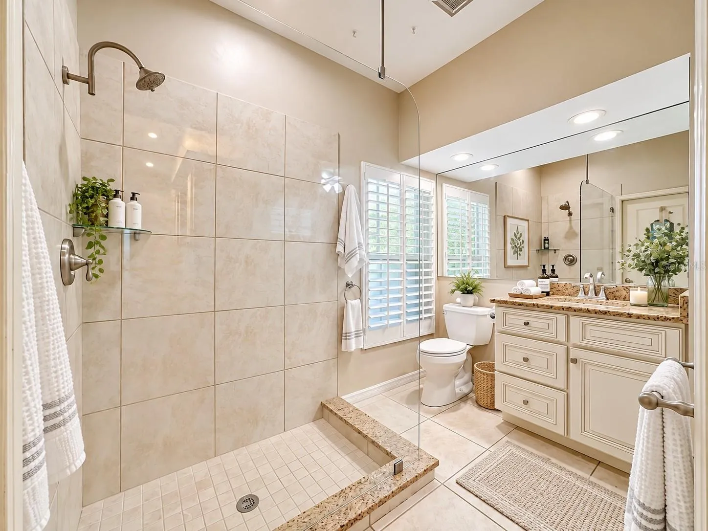 Bathroom #2 Frameless glass shower, tiled flooring.