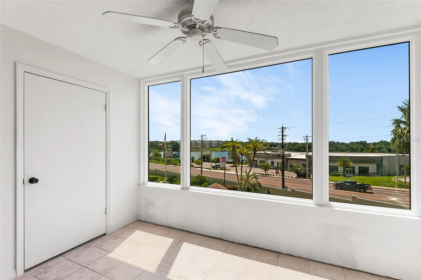 BONUS ROOM WITH VIEW TOWARDS LAKE. STORAGE CLOSET ON LEFT