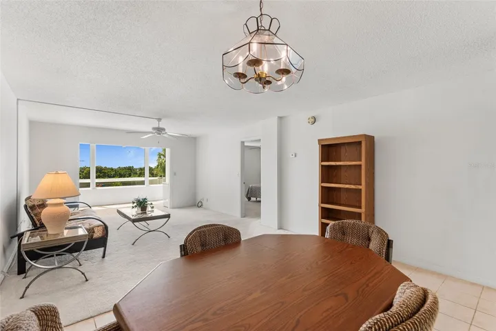 DINING AND LIVING ROOM AREA. BONUS ROOM BEYOND