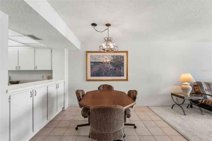 DINING AREA. PASS TRU FROM KITCHEN TO LEFT.