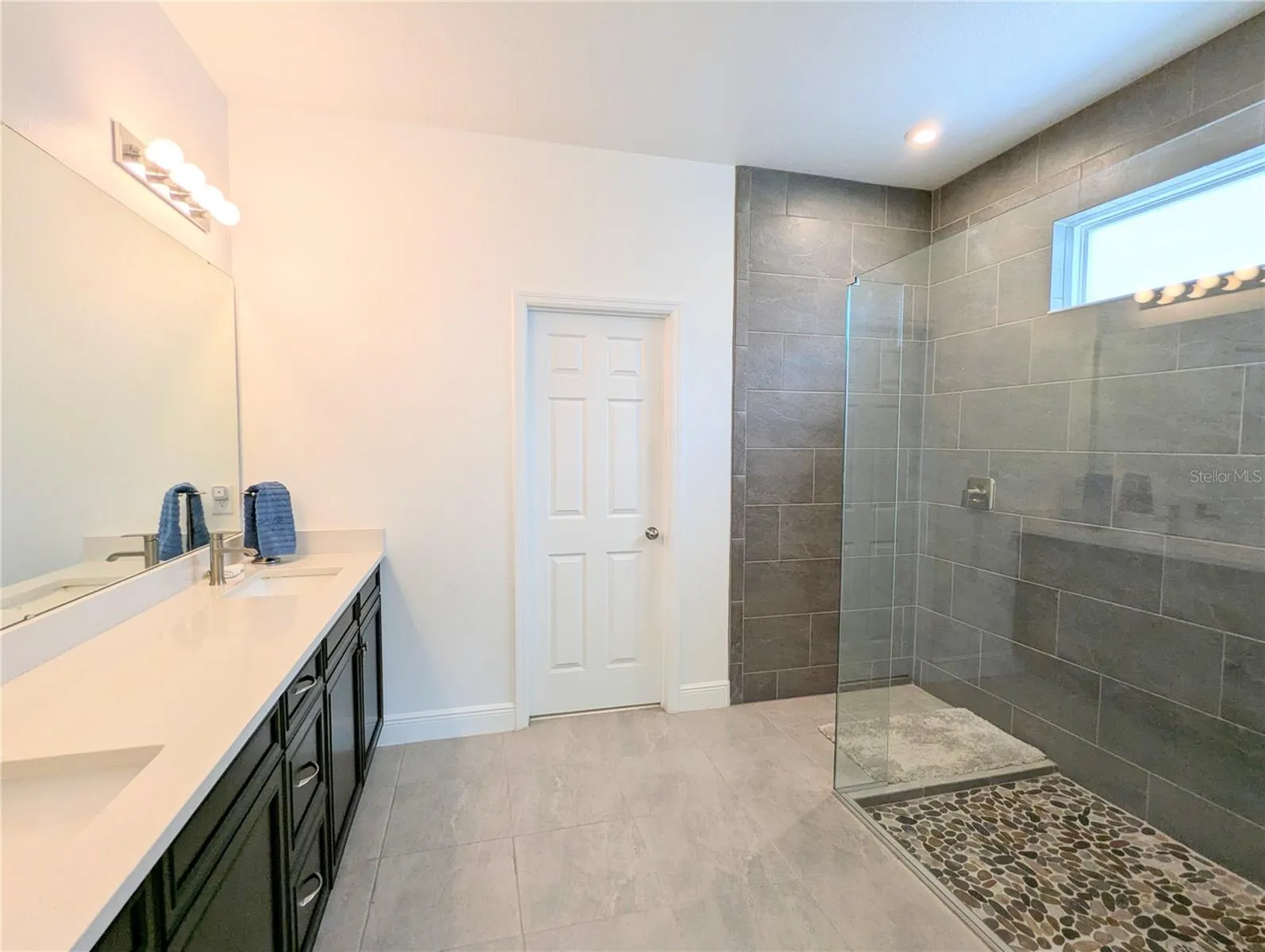 Dual sinks with tons of storage...room enough for all her things...a spot for him too!