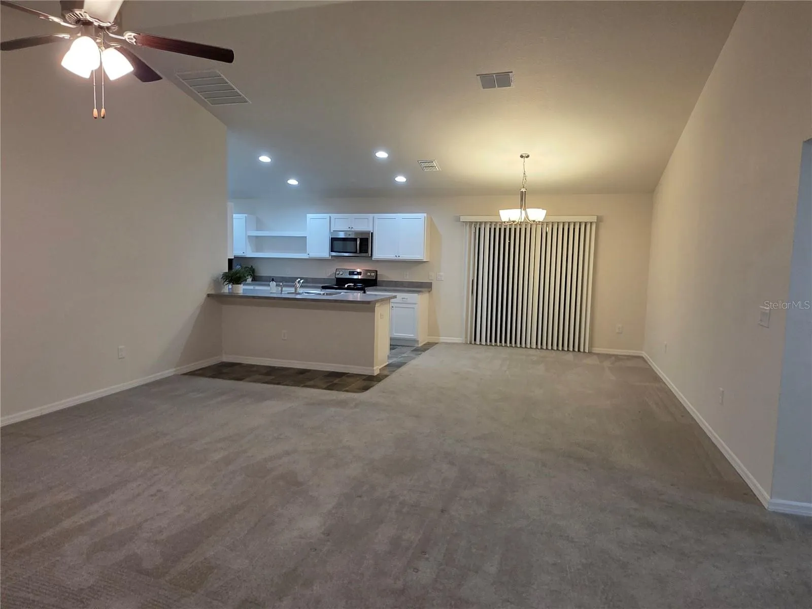 Living room into the dining area and open kitchen
