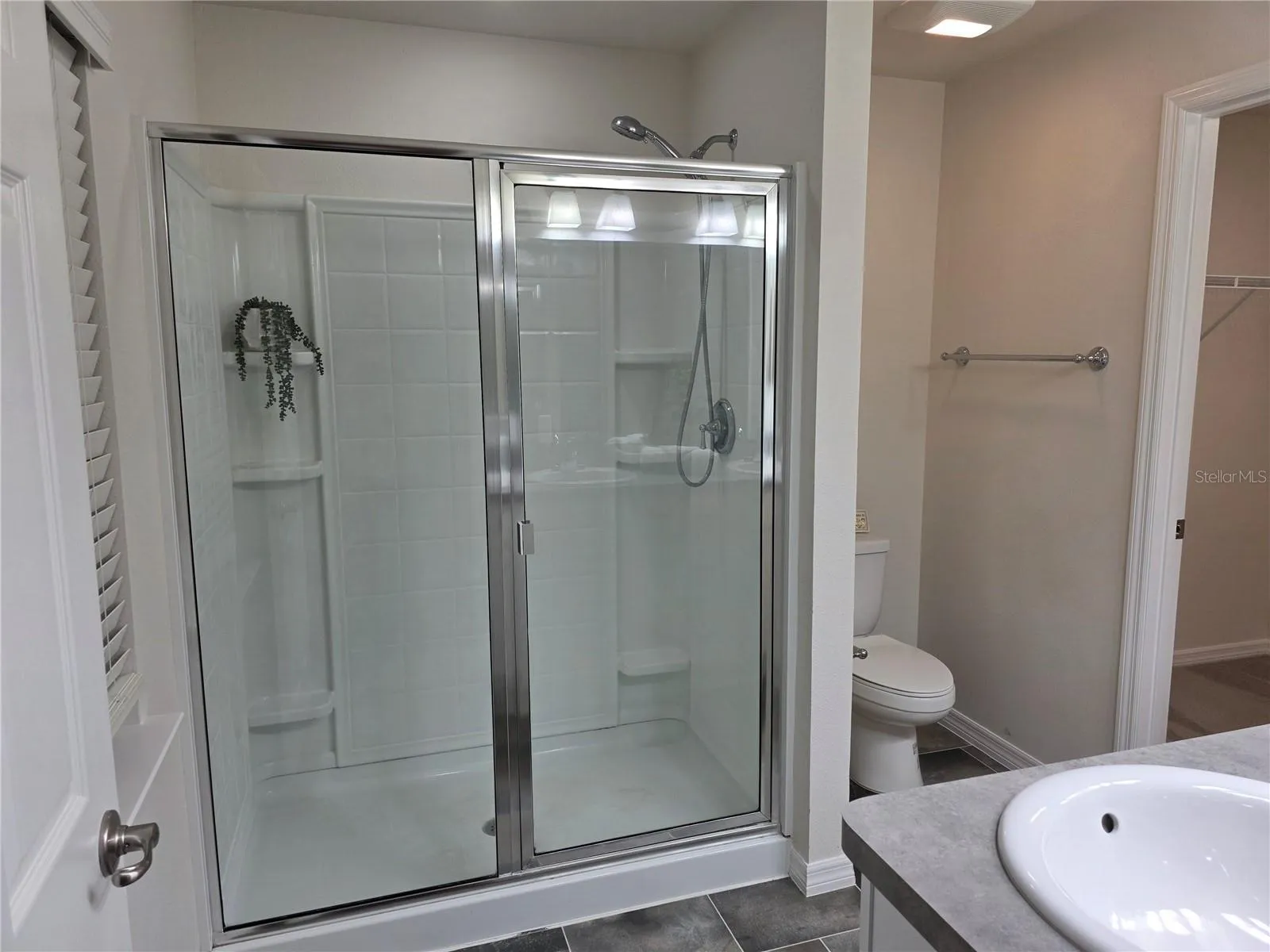 The shower in the primary bathroom