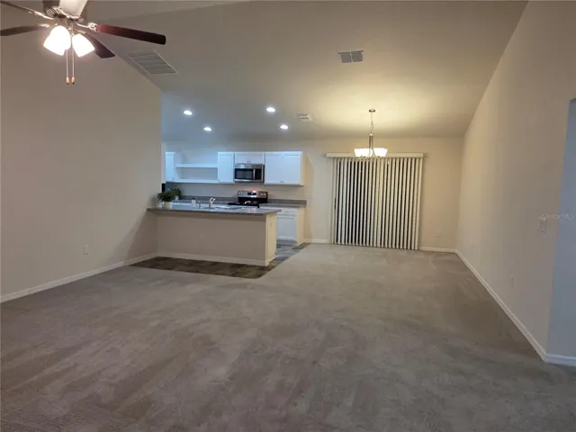 Living room into the dining area and open kitchen