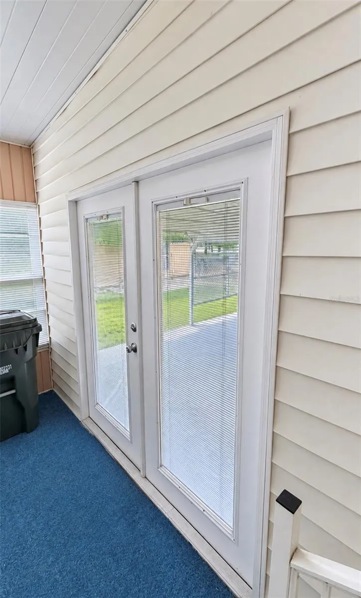 French doors to side enclosed lanai