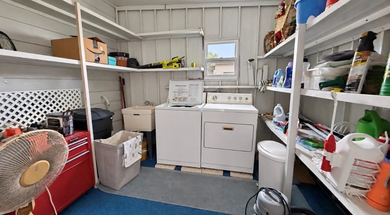 Shed with washer and dryer as well as a wash tub and water heater