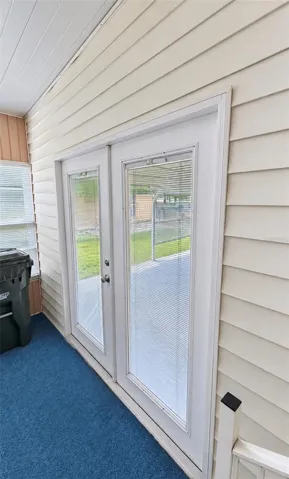 French doors to side enclosed lanai