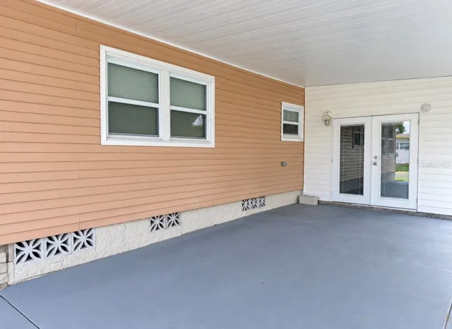Side fronch doors to enclosed lanai