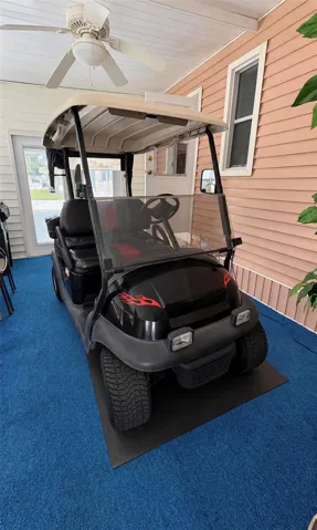 Enclosed lanai holds golf cart when on vacation
