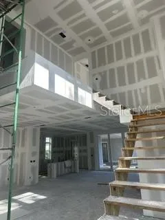Foyer and staircase - 21-foot ceiling, framed and drywalled