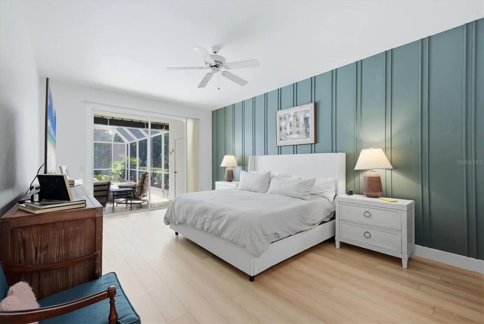 Primary bedroom with sliders to pool.