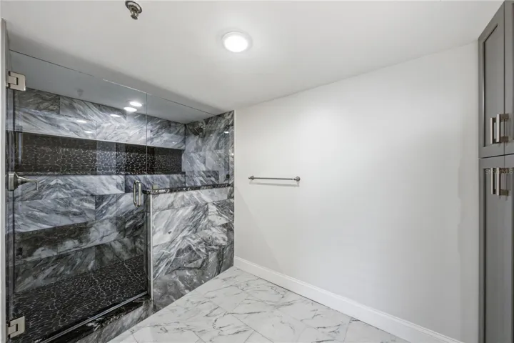 Primary bathroom with water closet and walk in shower