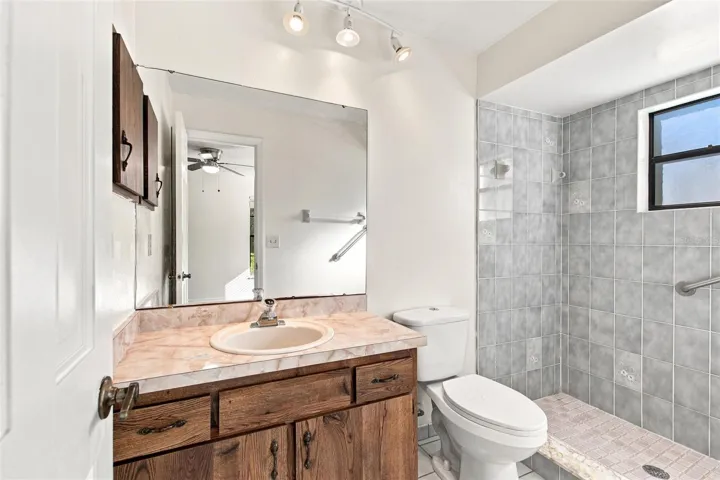 PRIMARY BATH WITH UPDATED TILE SHOWER