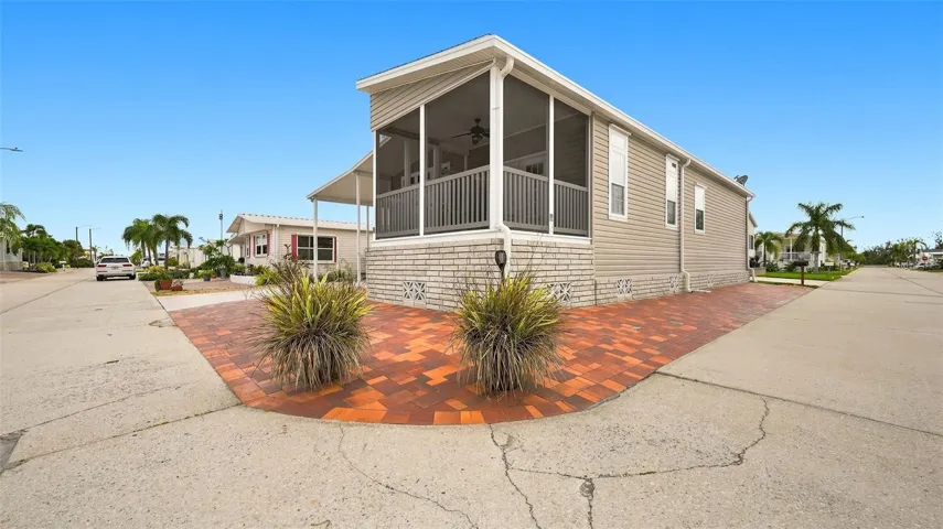 Brick pavers in front and on side offer additional parking for guests