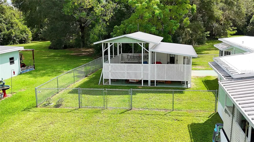 with fenced yard and RV port...