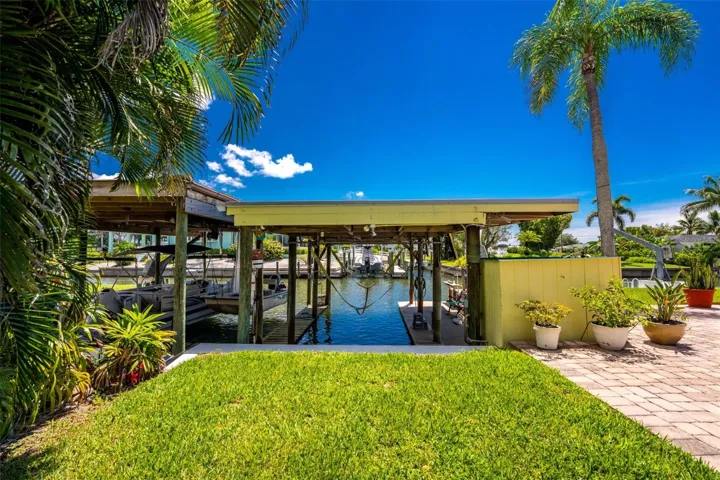 BACK YARD SHOWING BOATHOUSE