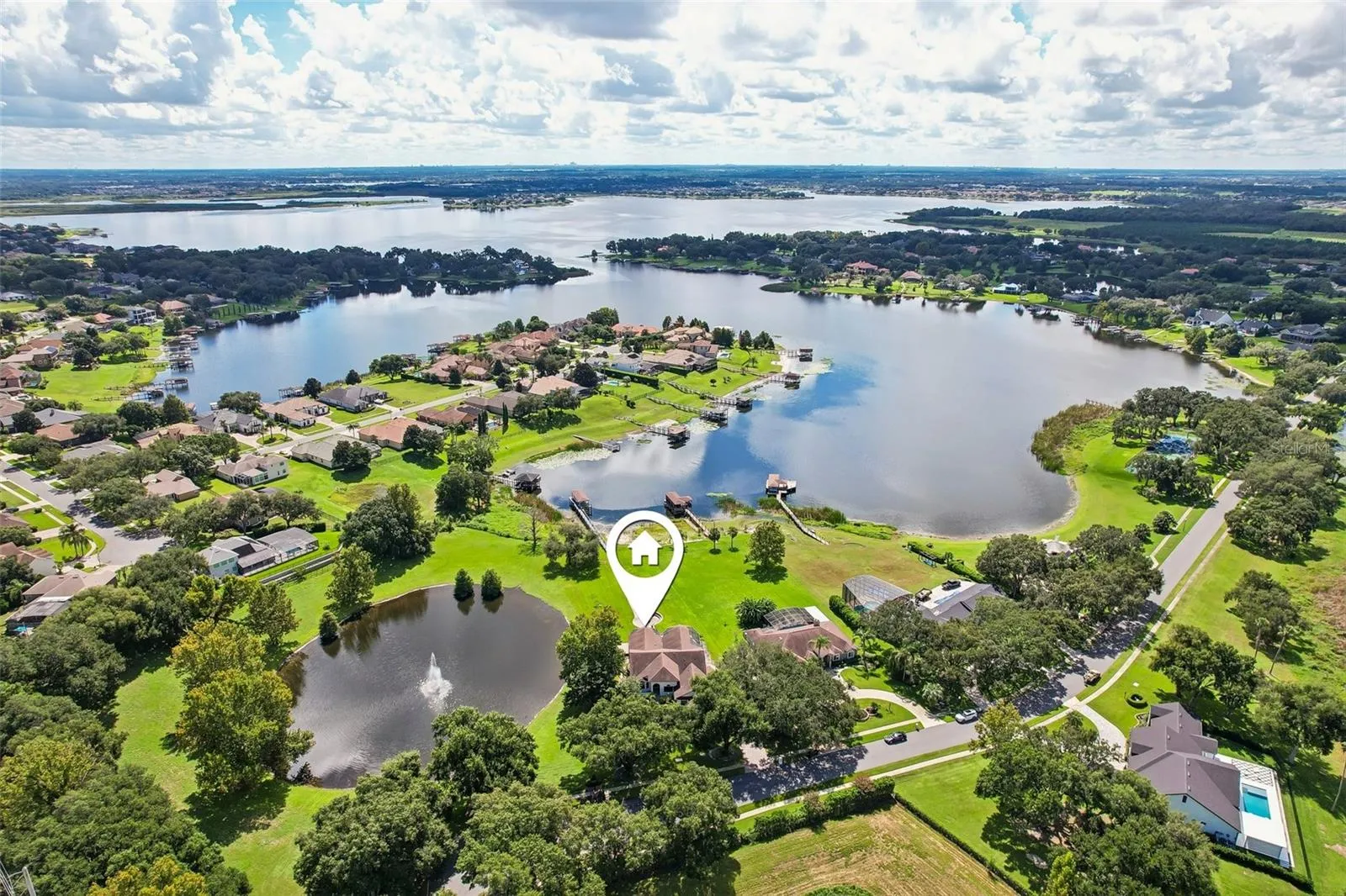 Surrounded by Johns Lake and the community pond.