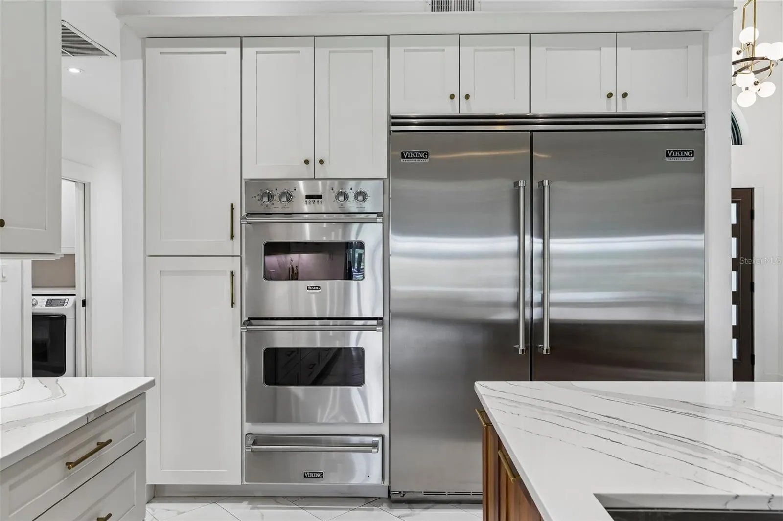 Viking 36" refrigerator and 30" freezer, double ovens and warming drawer.