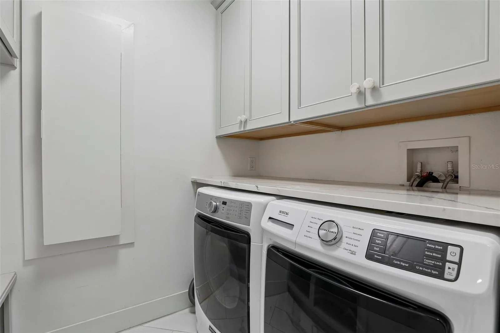 Laundry room with built ins.