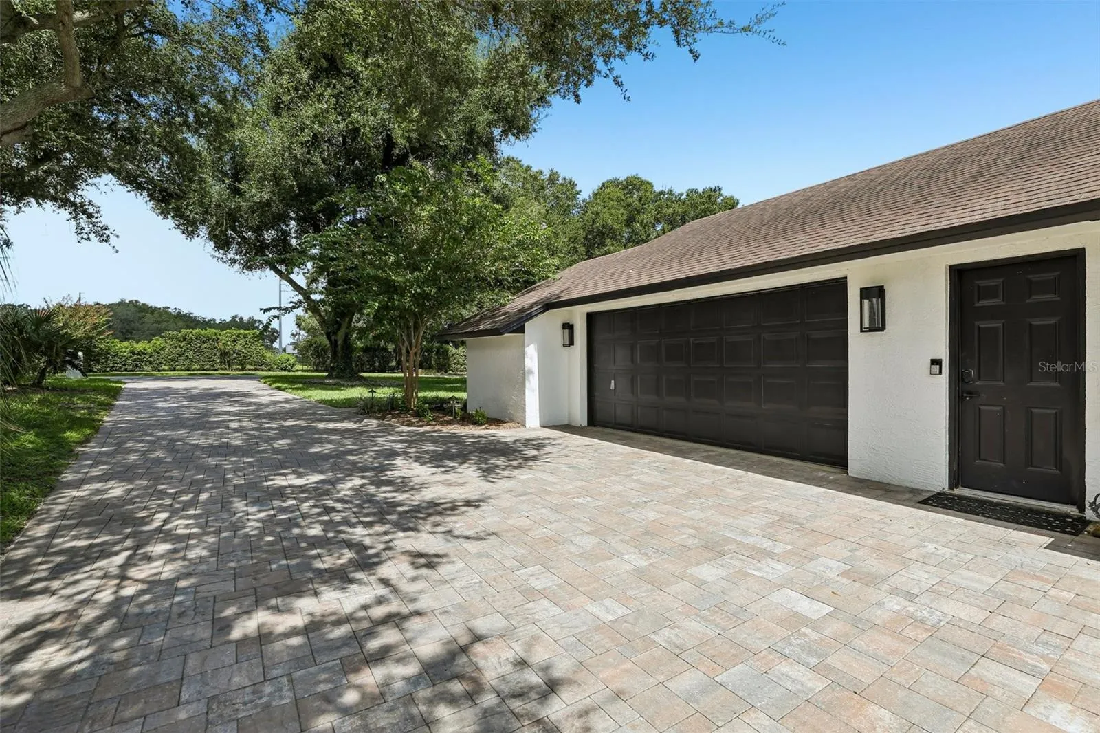 Plenty of parking on the extra long paver driveway.