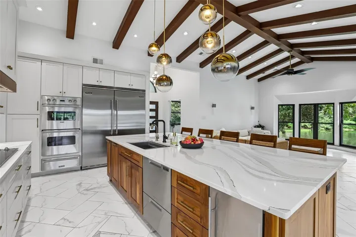 Large center island with drawer dishwasher and ice maker.