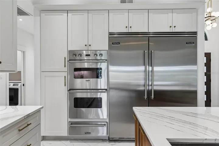 Viking 36" refrigerator and 30" freezer, double ovens and warming drawer.