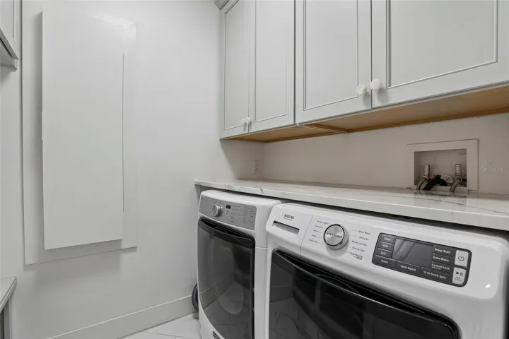Laundry room with built ins.