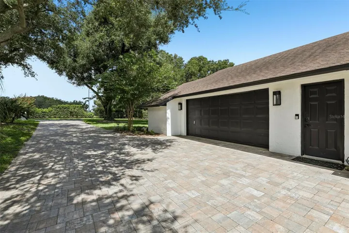 Plenty of parking on the extra long paver driveway.