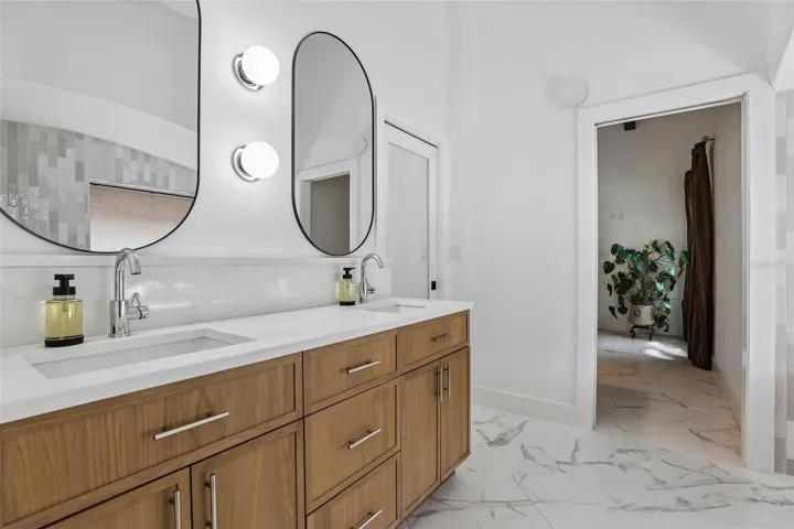 Brand new primary bath with dual sinks.