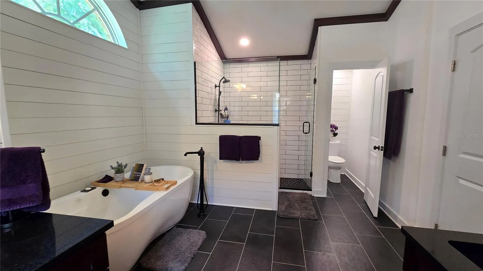 This Primary Bathroom is so large that it not only has a separate tub it also has a huge walk in shower as well as a separate room for privacy while in the bathroom.