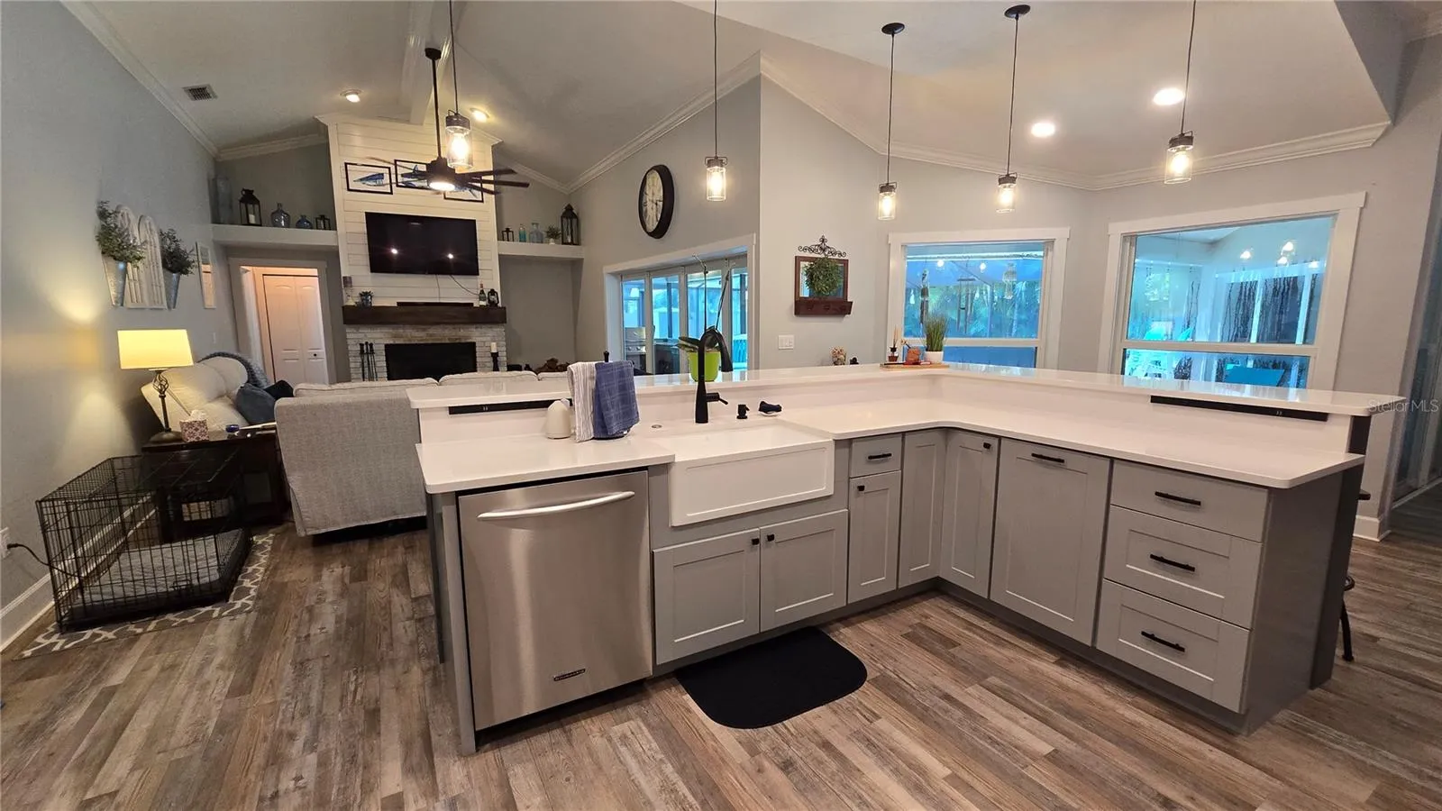 Kitchen overlooks the family room as well views of the outdoor screened in pool area.  No more missing out on the get togethers.  Lots of sitting area around the breakfast bar.