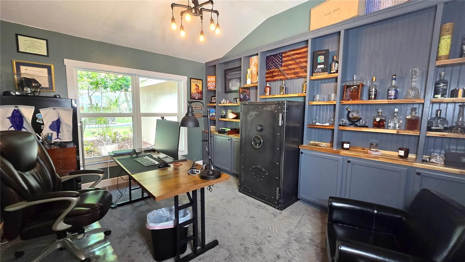This office is perfect for those who work from home or may just want a gaming room.  It very spacious with lots of shelves and cabinets.
