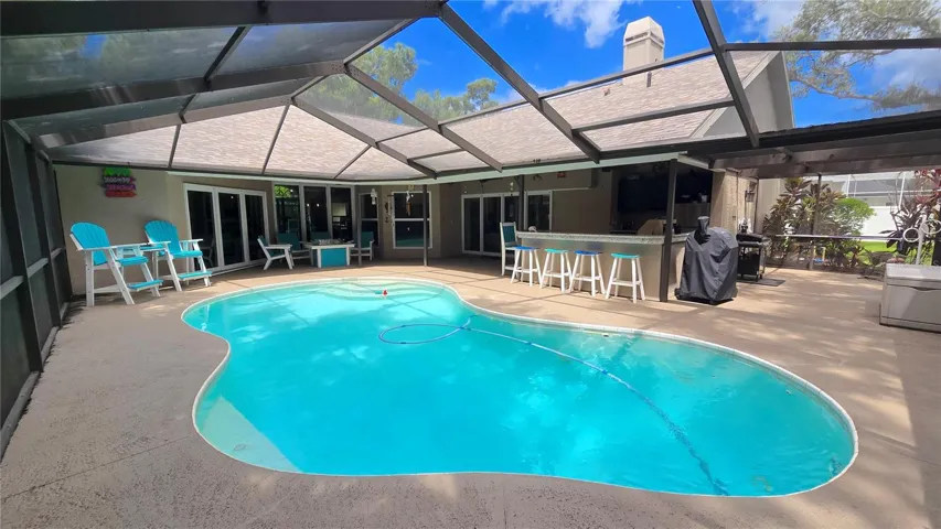 Entertainment galore right here around the pool, bar under the screened patio lanai.  This right here is what Florida is all about.  Now make this yours!