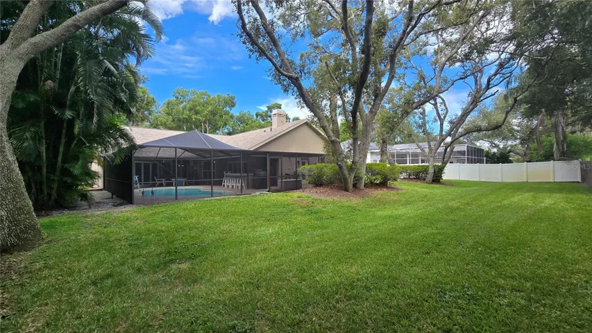 View of the pool area and the back yard.