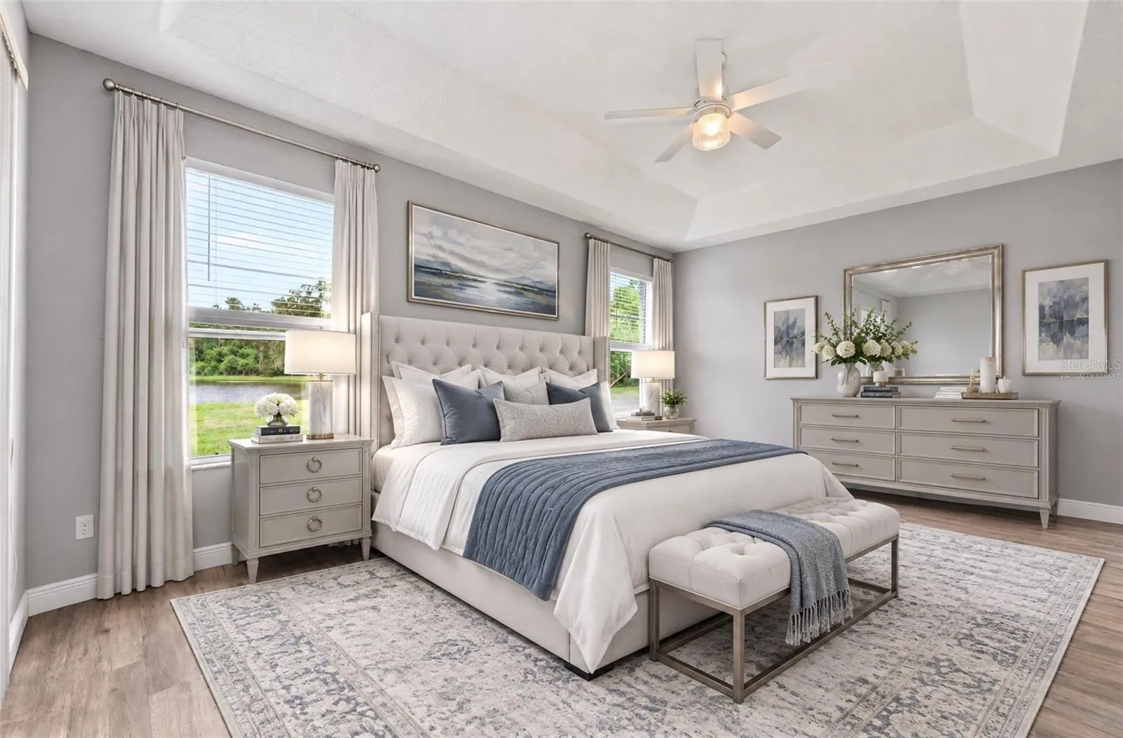 Light, bright, spacious primary suite has direct access to the lanai. Virtually Staged.