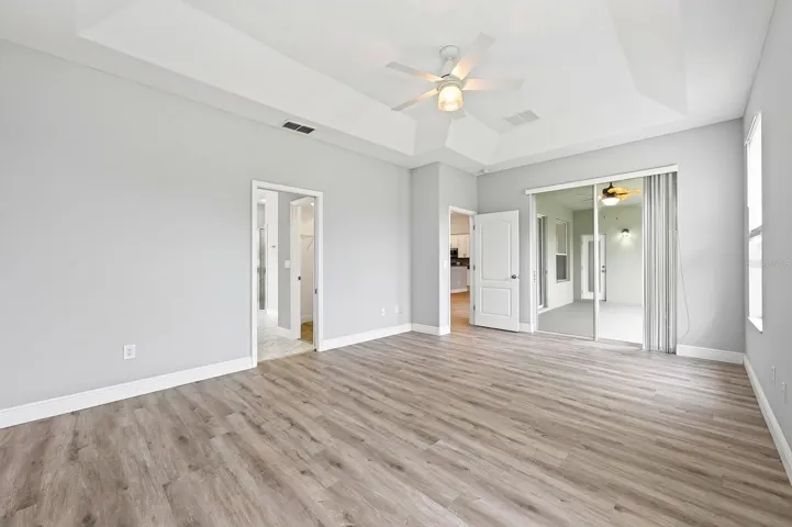 Light, bright, spacious primary suite has direct access to the lanai.