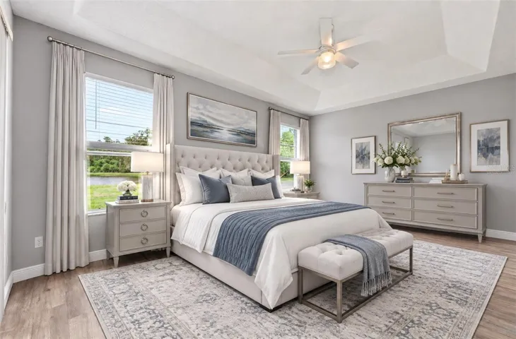 Light, bright, spacious primary suite has direct access to the lanai. Virtually Staged.