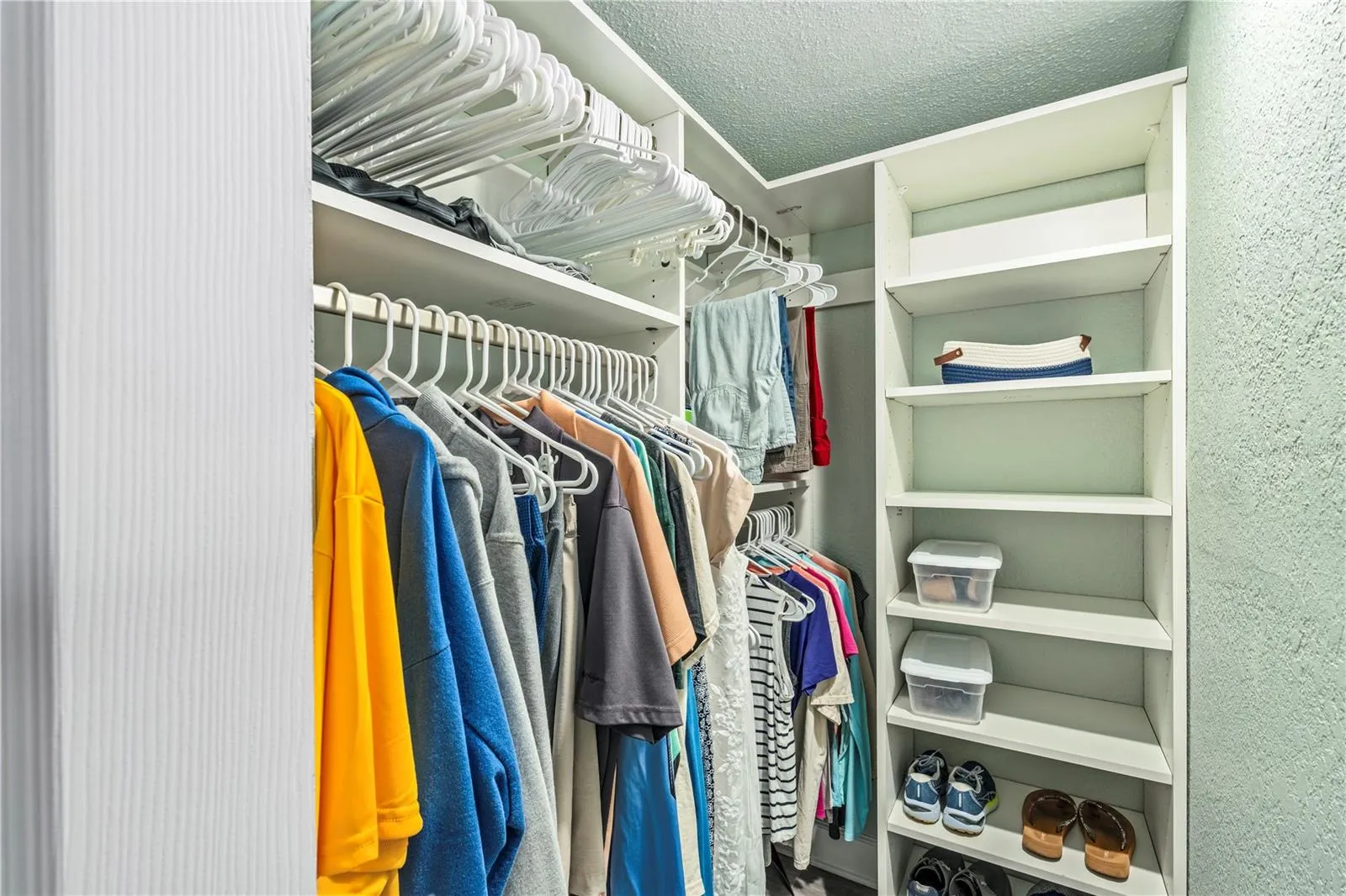 Primary bedroom walk in closet