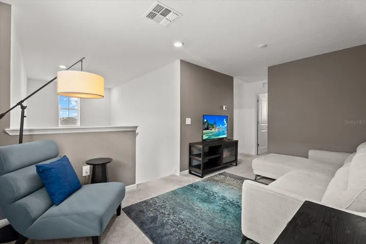 Spacious second-floor loft conveniently located near the bedrooms.