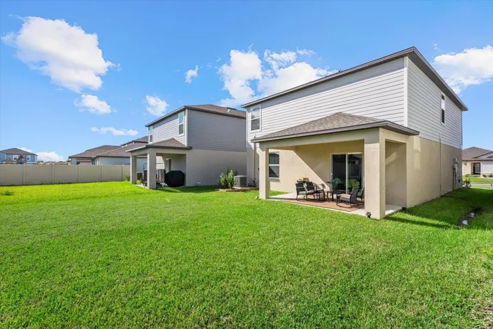 Expansive backyard offering plenty of room for recreation and outdoor entertaining.