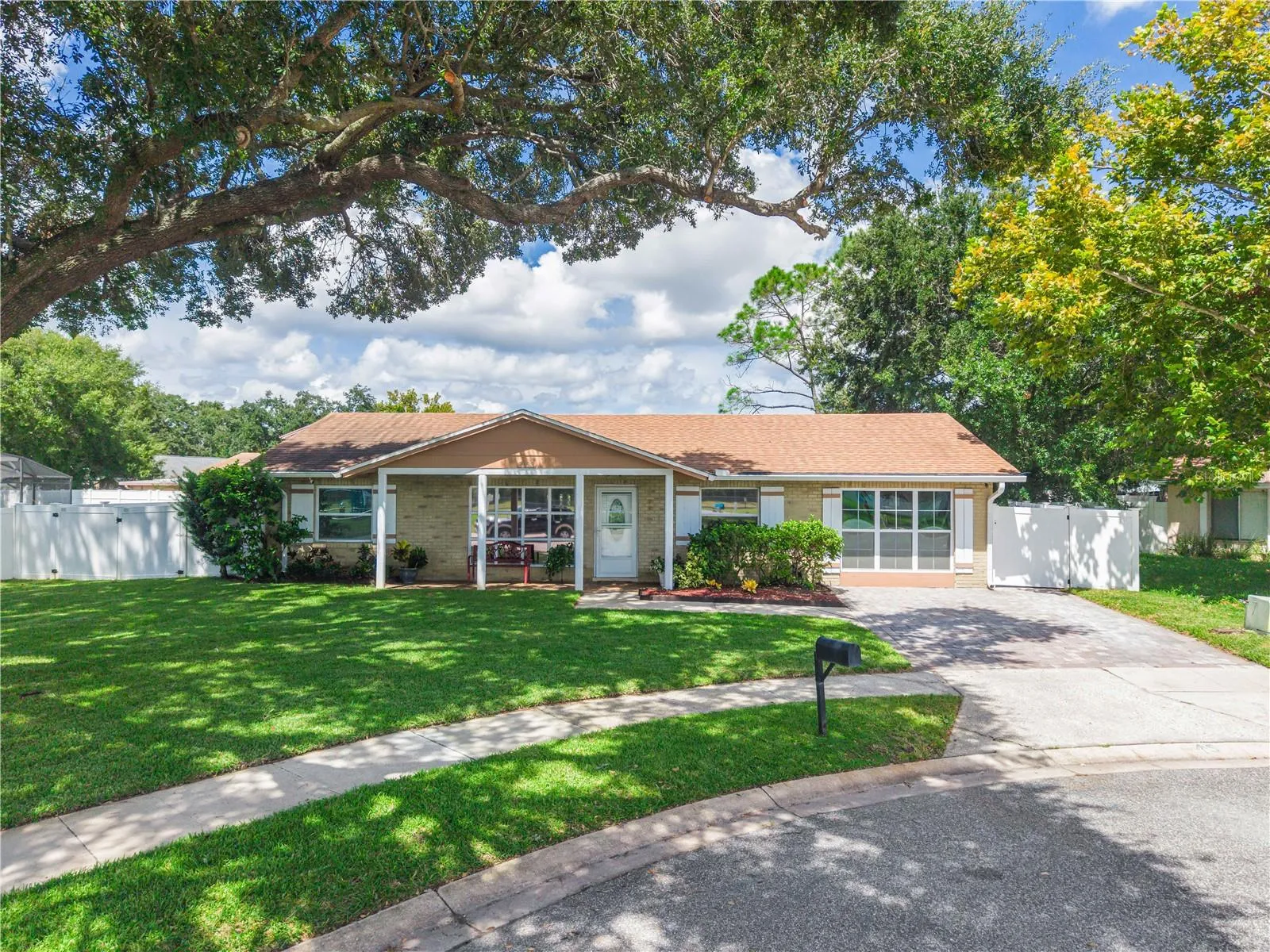 Front of Home with Beautiful Mature Tree Providing Shade