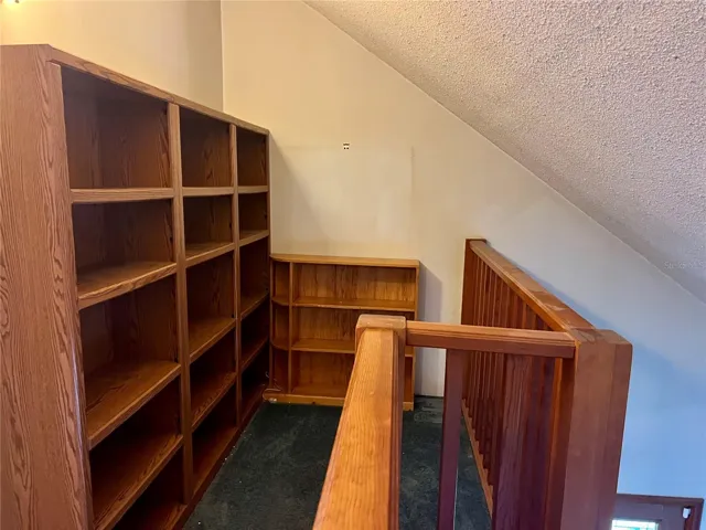 Loft bookshelves office area