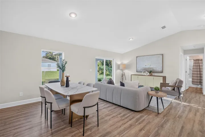 Staged dining area and living room view