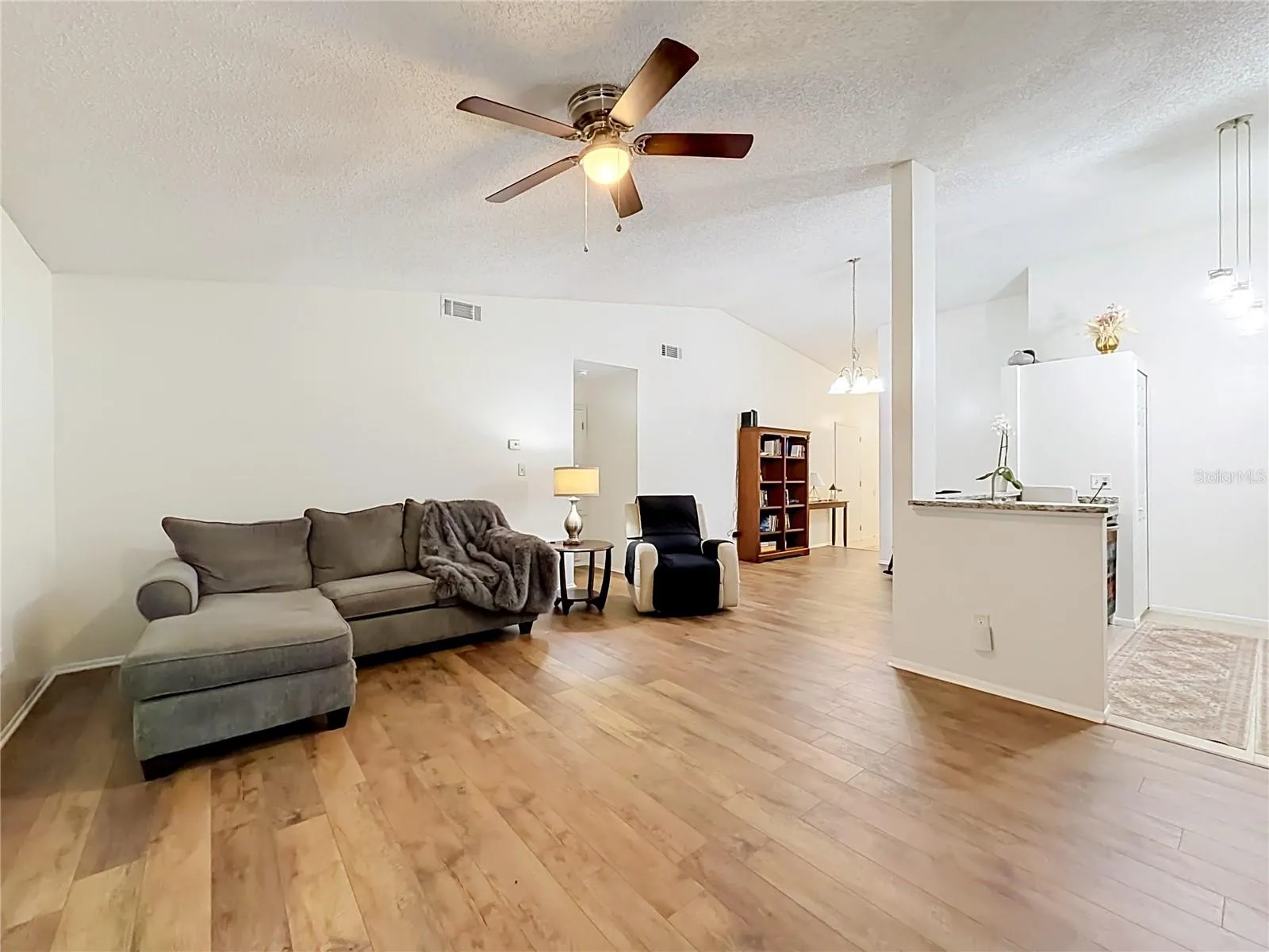 Living Room open to Kitchen and Dining area.