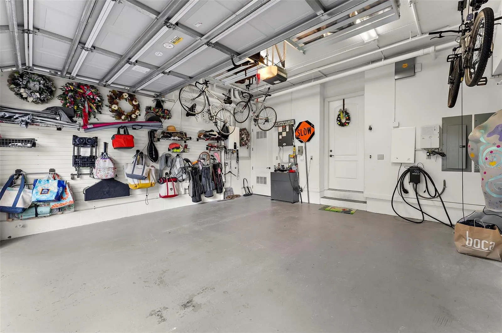 Private 2 car garage with storage + activity wall